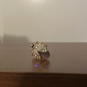 Elastic beetle ring with purple cat eye and rhinestones